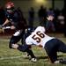 Milan junior quarterback Robert Kanitz avoids being tackled by Tecumseh sophomore Doug Sheats on Friday. Daniel Brenner I AnnArbor.com
